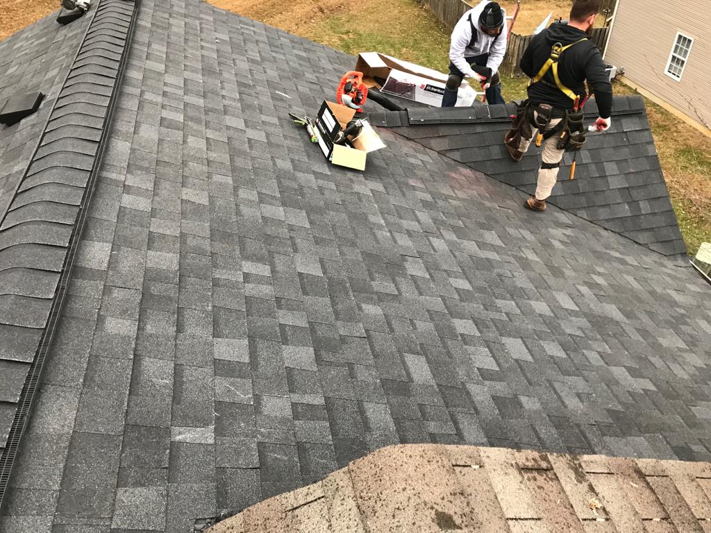 Workers working on new roof